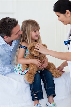 simsearch:400-05748268,k - Doctor examining smiling child and mom Stock Photo - Budget Royalty-Free & Subscription, Code: 400-04157732