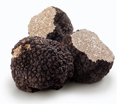 Black truffles on a white background Foto de stock - Royalty-Free Super Valor e Assinatura, Número: 400-04157867