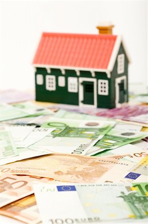 simsearch:400-06770104,k - House on money field or foundation - financial concept Foto de stock - Super Valor sin royalties y Suscripción, Código: 400-04157937