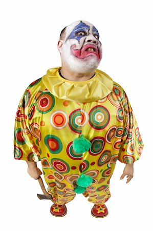 A nasty evil clown holding an axe, angry and looking mean. Fisheye lens with focus on the face. Stock Photo - Budget Royalty-Free & Subscription, Code: 400-04158382