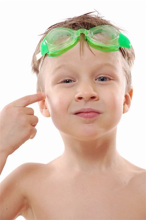 smile as mask for boy - studio shot of a smiling elementary age boy with wet hair and goggles over white Stock Photo - Budget Royalty-Free & Subscription, Code: 400-04158435