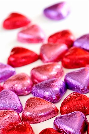 simsearch:400-04685521,k - Valentine's chocolates wrapped in red and purple foil on white background Photographie de stock - Aubaine LD & Abonnement, Code: 400-04158530