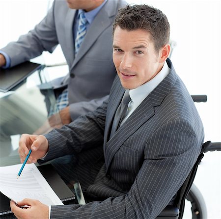 simsearch:400-05147195,k - Close-up of a caucasian businessman in a wheelchair during a meeting with his colleagues Stock Photo - Budget Royalty-Free & Subscription, Code: 400-04159613