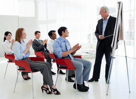 simsearch:400-08654020,k - Business people applauding at the end of a conference in the office Foto de stock - Royalty-Free Super Valor e Assinatura, Número: 400-04159642