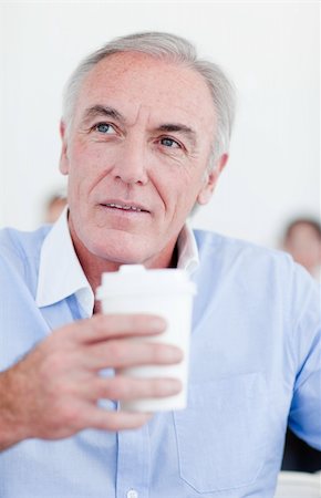 simsearch:400-04204942,k - Senior businessman holding a drinking cup at work Stock Photo - Budget Royalty-Free & Subscription, Code: 400-04159692