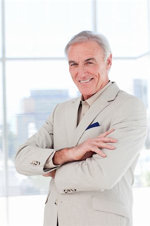 simsearch:400-05118165,k - Attractive senior businessman with folded arms in a business building Stock Photo - Budget Royalty-Free & Subscription, Code: 400-04159722