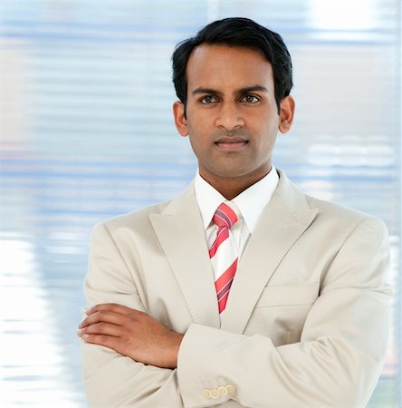 simsearch:400-05118165,k - Serious ethnic businessman with folded arms in the office Stock Photo - Budget Royalty-Free & Subscription, Code: 400-04159736