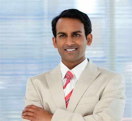 simsearch:400-05118165,k - Smiling businessman with folded arms in a business building Stock Photo - Budget Royalty-Free & Subscription, Code: 400-04159737