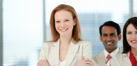 simsearch:400-04097612,k - Smiling businesswoman with her colleagues in a business building Fotografie stock - Microstock e Abbonamento, Codice: 400-04159738