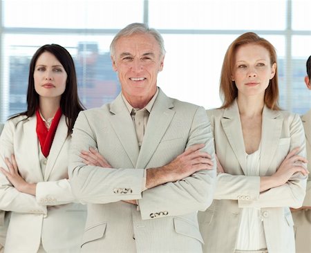 simsearch:400-05118165,k - Portrait of a serious business team with folded arms in a business building Stock Photo - Budget Royalty-Free & Subscription, Code: 400-04159745