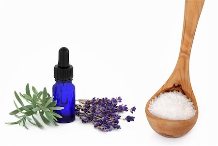 simsearch:400-04141304,k - Lavender herb flowers and leaf sprig with an aromatherapy essential oil glass dropper bottle and wooden ladle with sea salt, over white background. Photographie de stock - Aubaine LD & Abonnement, Code: 400-04150126