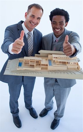 High view of architects holding a model house with thumbs up Stock Photo - Budget Royalty-Free & Subscription, Code: 400-04150205