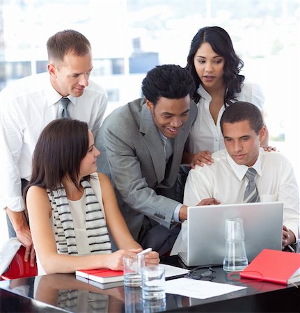 Business people working together with a laptop in office Stock Photo - Budget Royalty-Free & Subscription, Code: 400-04150218