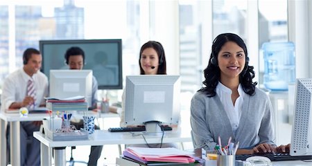 Ethnic businesswoman with a headset on in a call center Stock Photo - Budget Royalty-Free & Subscription, Code: 400-04150245