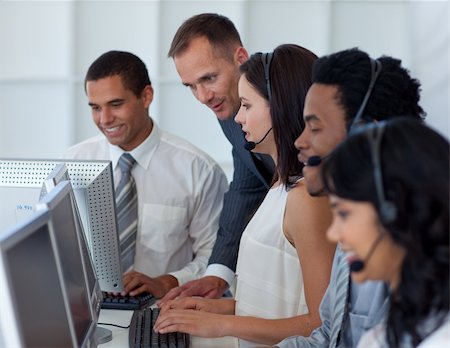 Manager helping his business team working in a call center Stock Photo - Budget Royalty-Free & Subscription, Code: 400-04150289