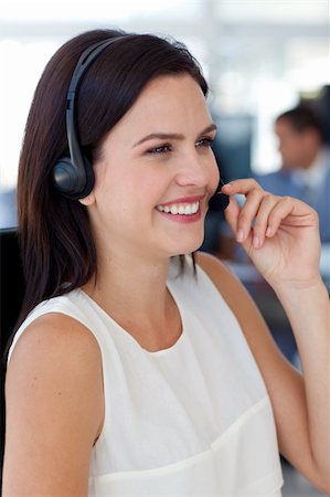 simsearch:400-03990860,k - Beautiful businesswoman talking on a headset in a call centre Photographie de stock - Aubaine LD & Abonnement, Code: 400-04150317