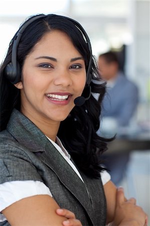 simsearch:400-03990860,k - Confident ethnic businesswoman working in a call center Photographie de stock - Aubaine LD & Abonnement, Code: 400-04150327