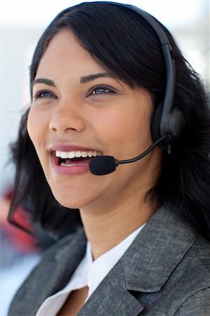 simsearch:400-03990860,k - Smiling ethnic businesswoman working in a call center Photographie de stock - Aubaine LD & Abonnement, Code: 400-04150329