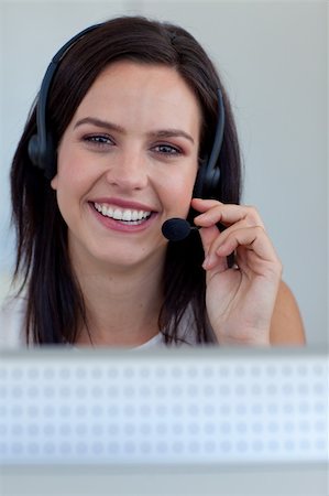 simsearch:400-03990860,k - Portrait of a beautiful businesswoman working in a call centre Photographie de stock - Aubaine LD & Abonnement, Code: 400-04150321