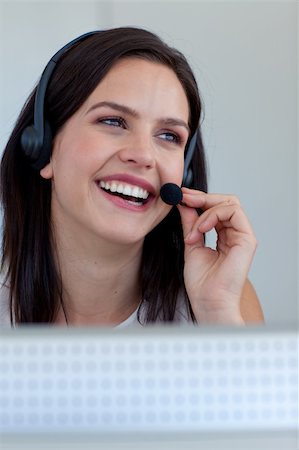 simsearch:400-03990860,k - Smiling businesswoman working in a call centre Photographie de stock - Aubaine LD & Abonnement, Code: 400-04150322