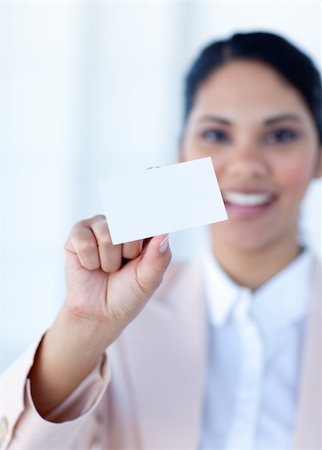 simsearch:400-04648812,k - Ethnic businesswoman holding a white card in office Stock Photo - Budget Royalty-Free & Subscription, Code: 400-04150335