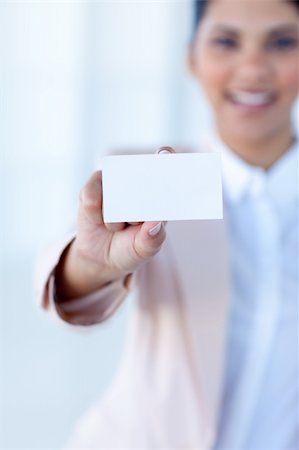 simsearch:400-04648812,k - Businesswoman holding a white card in office Stock Photo - Budget Royalty-Free & Subscription, Code: 400-04150336