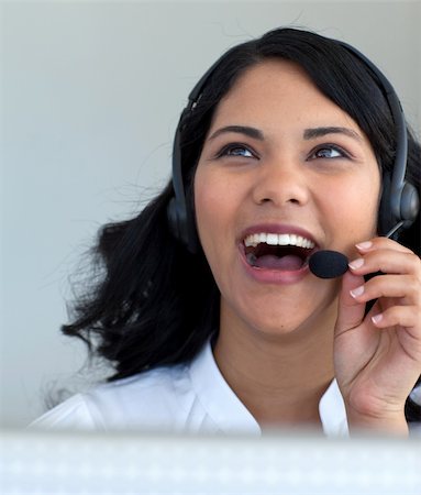 simsearch:400-03990860,k - Beautiful businesswoman talking on a headset in a call center Photographie de stock - Aubaine LD & Abonnement, Code: 400-04150332