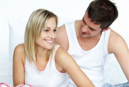 Young lovers together sitting on bed Stock Photo - Budget Royalty-Free & Subscription, Code: 400-04150404