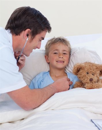 sick boy with teddy - Doctor listening to a child chest with stethoscope in bed Stock Photo - Budget Royalty-Free & Subscription, Code: 400-04150516