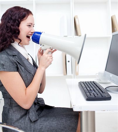 simsearch:400-06763387,k - Businesswoman yelling through a megaphone in office Stock Photo - Budget Royalty-Free & Subscription, Code: 400-04150595