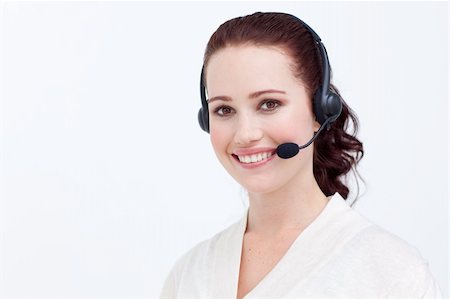 simsearch:400-03990860,k - Attractive businesswoman with a headset on smiling at the camera Photographie de stock - Aubaine LD & Abonnement, Code: 400-04150591