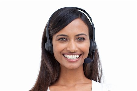 simsearch:400-03990860,k - Portrait of a beautiful ethnic businesswoman with a headset on Photographie de stock - Aubaine LD & Abonnement, Code: 400-04150604