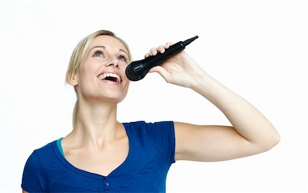 Beautiful woman singing on a microphone against white background Stock Photo - Budget Royalty-Free & Subscription, Code: 400-04150633