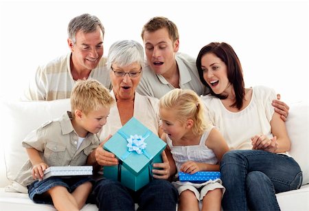 parents and grandparents birthday party - Family giving a present to grandmother for her birthday Stock Photo - Budget Royalty-Free & Subscription, Code: 400-04150750