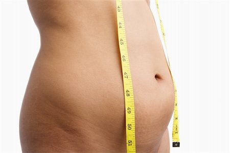 simsearch:400-06178010,k - Female mid section with measuring tape for obesity issue Stock Photo - Budget Royalty-Free & Subscription, Code: 400-04150820