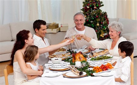 picture people eating thanksgiving dinner - Family tusting in a Christmas dinner at home Stock Photo - Budget Royalty-Free & Subscription, Code: 400-04151059