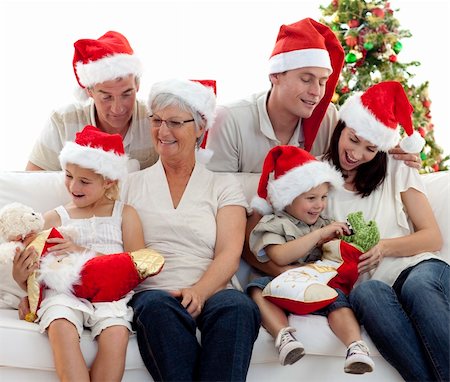 Happy smiling family with Christmas gifts at home Stock Photo - Budget Royalty-Free & Subscription, Code: 400-04151099