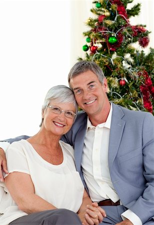 senior woman at christmas parties - Portrait of mature couple celebrating Christmas at home Stock Photo - Budget Royalty-Free & Subscription, Code: 400-04151106