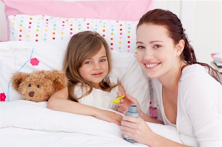 simsearch:400-05749823,k - Sick little girl in bed taking cough medicine with her mother Foto de stock - Super Valor sin royalties y Suscripción, Código: 400-04151208
