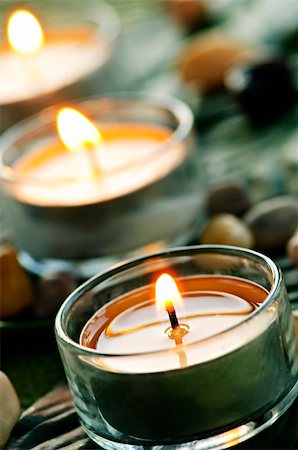 simsearch:400-04143553,k - Burning candles in glass holders on green leaf Stock Photo - Budget Royalty-Free & Subscription, Code: 400-04151385