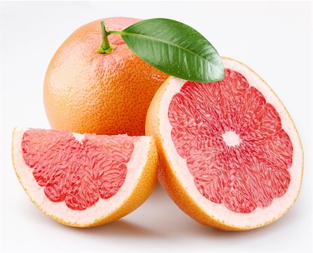 Grapefruits and segments with a leaf on a white background Foto de stock - Royalty-Free Super Valor e Assinatura, Número: 400-04151541