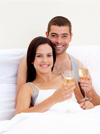 simsearch:400-04150404,k - Happy young couple drinking champagne in bed Stock Photo - Budget Royalty-Free & Subscription, Code: 400-04152055