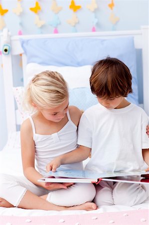 simsearch:400-04157519,k - Little brother and sister reading a book in bedroom Stock Photo - Budget Royalty-Free & Subscription, Code: 400-04152187