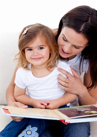 simsearch:400-05749644,k - Little girl reading a book withher mother in living-room Stock Photo - Budget Royalty-Free & Subscription, Code: 400-04152241