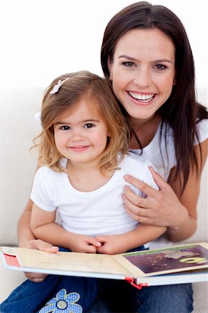 simsearch:400-05749644,k - Smiling mother and daughter reading a book Stock Photo - Budget Royalty-Free & Subscription, Code: 400-04152242