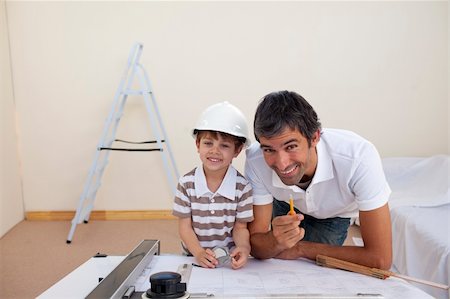 family portraits in frames - Father and son refurbishing a bedroom at home Stock Photo - Budget Royalty-Free & Subscription, Code: 400-04152270