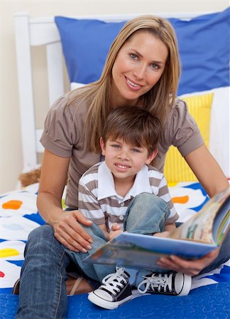 simsearch:400-05751566,k - Attractive mother reading a book with her son in bed Stock Photo - Budget Royalty-Free & Subscription, Code: 400-04152308
