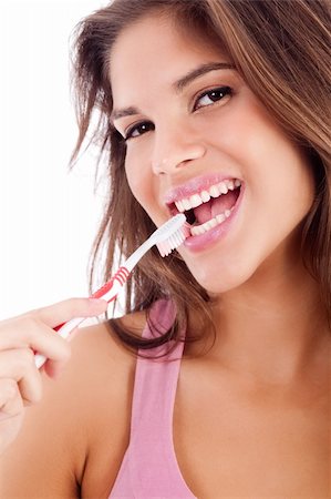 advertisement of cute girl brushing her teeth on isolated white backround Stock Photo - Budget Royalty-Free & Subscription, Code: 400-04152453