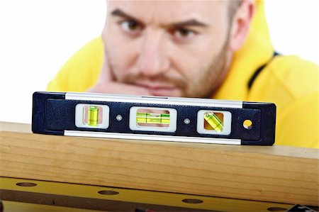 simsearch:400-04648821,k - young manual worker check spirit level isolated on white Foto de stock - Royalty-Free Super Valor e Assinatura, Número: 400-04152692