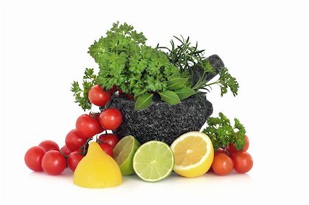 Herb leaf selection in a granite mortar with pestle with lemon and lime halves and tomatoes on the vine, over white background. Stock Photo - Budget Royalty-Free & Subscription, Code: 400-04153008